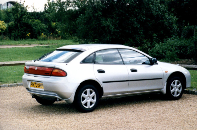 photo of silver Mazda 323
